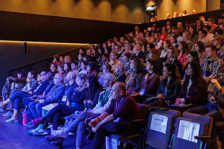 The audience listening intently during a talk.