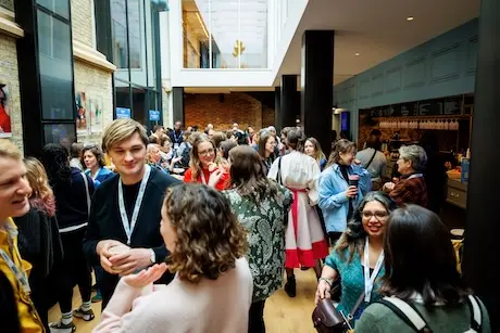 Attendees chatting during a break.